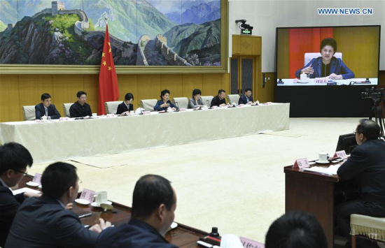 Chinese Vice Premier Liu Yandong (4th R, back) attends a national video and telephone conference on health reform in Beijing, capital of China, March 28, 2017. (Xinhua/Gao Jie)