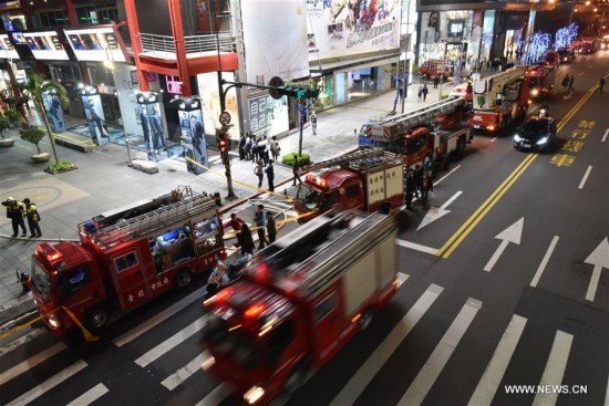 Rescuers work at the site of a cinema fire in Taipei, southeast China, March 29, 2017. A cinema fire in downtown Taipei Wednesday night has forced the evacuation of nearly 1,000 people, the city's fire department said. The fire has been put out. No casualties were reported. (Xinhua/Ou Dongqu)