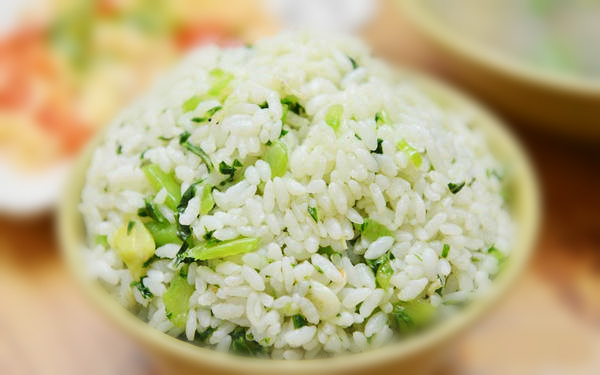 Steamed rice with leaf mustard. (File photo)