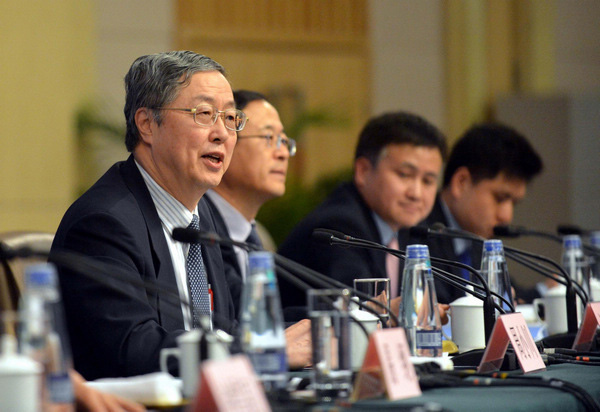 Zhou Xiaochuan, China's central bank governor, speaks at a news conference on China's currency policy and financial reform held by the first session of the 12th National People's Congress (NPC) in Beijing, March 13, 2013. (Photo/Xinhua)