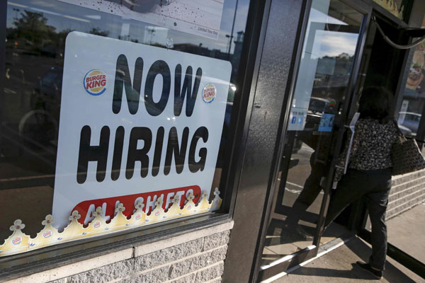 An advertisement for job openings is seen outside a Burger King franchise in Port Washington, New York, in this file photo taken Sept 16, 2015. (Photo/Agencies)