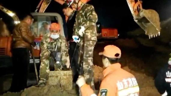 Firefighters toiled for nine hours overnight on Monday to pull a little boy out of a deep, narrow dry well in east China's Shandong Province. (Photo/CGTN)