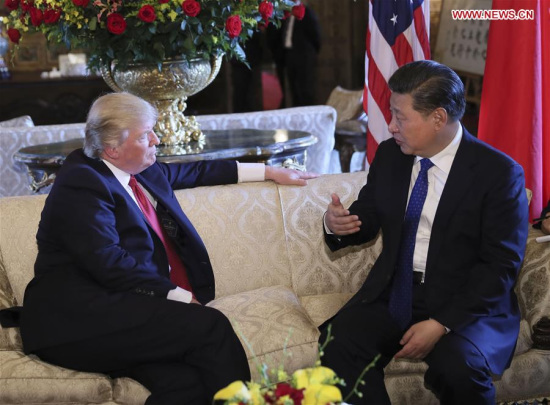 Chinese President Xi Jinping (R) meets with his U.S. counterpart Donald Trump in the latter's Florida resort of Mar-a-Lago in the United States, April 6, 2017. (Xinhua/Lan Hongguang)