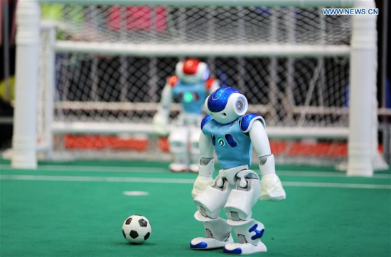 Robots take part in a soccer match during the 2017 RoboCup in Rizhao, east China's Shandong Province, April 2, 2017. The 2017 RoboCup attracted 418 teams around China. (Xinhua/Zhang Lei)