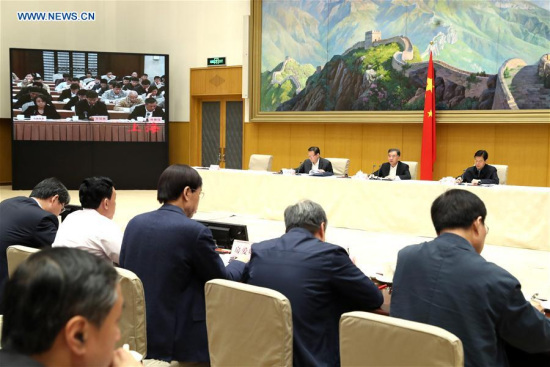 Chinese Vice Premier Wang Yang (C, rear) attends a national meeting on intellectual property piracy and counterfeit control in Beijing, capital of China, April 11, 2017. (Xinhua/Ma Zhancheng)