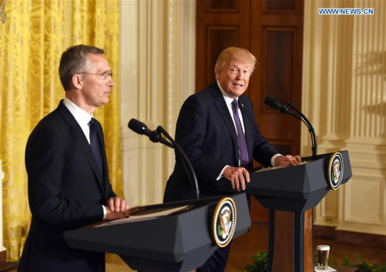 U.S. President Donald Trump (R) and visiting NATO Secretary General Jens Stoltenberg attend a joint press conference in Washington D.C., the United States, on April 12, 2017. (Xinhua/Yin Bogu)