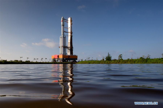 Photo taken on April 17, 2017 shows the cargo spacecraft Tianzhou-1 being transferred with a Long March-7 Y2 carrier rocket from the testing center to the launch zone in Wenchang, south China's Hainan Province. (Xinhua/Ju Zhenhua)