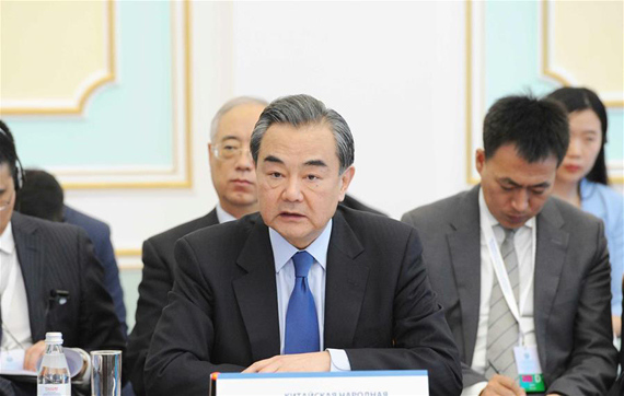 Chinese Foreign Minister Wang Yi (C) speaks at the Shanghai Cooperation Organization (SCO) foreign ministers meeting in Astana, Kazakhstan, April 21, 2017. (Xinhua/Sadat)