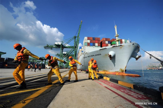 Merchant Vessel (M.V.) COSCO Netherlands berths at Singapore's Pasir Panjang terminal, on April 23, 2017. (Xinhua/Then Chih Wey)