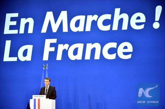 Emmanuel Macron, French presidential candidate for the On the Move (En Marche) movement, delivers a speech at a rally after the first round of French presidential election in Paris, France on April 23, 2017. (Xinhua/Jose Rodriguez)