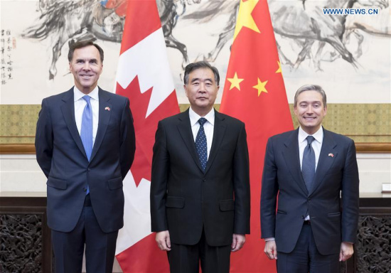 Chinese Vice Premier Wang Yang (C), along with Canadian Finance Minister Morneau (L) and Canadian International Trade Minister Champagne, launches the China-Canada Economic and Financial Strategic Dialogue in Beijing, capital of China, April 25, 2017. (Xinhua/Ding Haitao)