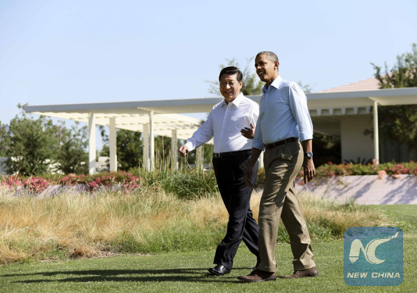 Chinese President Xi Jinping (L) and Barack Obama, then U.S. president, take a walk before heading into their second meeting, at the Annenberg Retreat in California of the U.S., June 8, 2013. (Xinhua/Lan Hongguang)