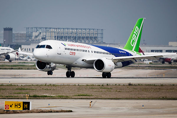 The C919, China's first domestically produced passenger jet, undergoes its fourth high-speed taxiing test in Shanghai on Sunday. YIN LIQIN/CHINA DAILY