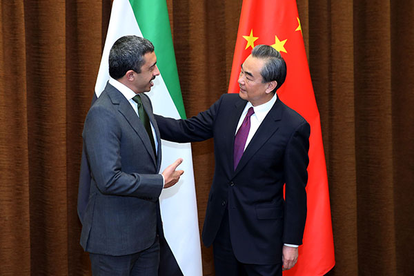 Foreign Minister Wang Yi meets Sheikh Abdullah bin Zayed Al Nahyan, minister of foreign affairs and international cooperation of the United Arab Emirates, in Beijing on Tuesday. The two cochaired the first meeting of the ChinaUAE Intergovernmental Cooperation Committee. WANG ZHUANGFEI / FOR CHINA DAILY