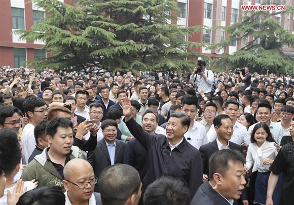 Chinese President Xi Jinping waves to teachers and students while inspecting China University of Political Science and Law in Beijing, capital of China, May 3, 2017. (Xinhua/Ding Lin)
