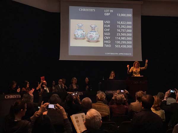 A pair of rare Chinese famille rose vases from the Qing Dynasty (1644-1911) sold for 13 million pounds ($16.8 million) at Christie's auction house in London on Tuesday. (Photo by Du Xiaoying/chinadaily.com.cn)