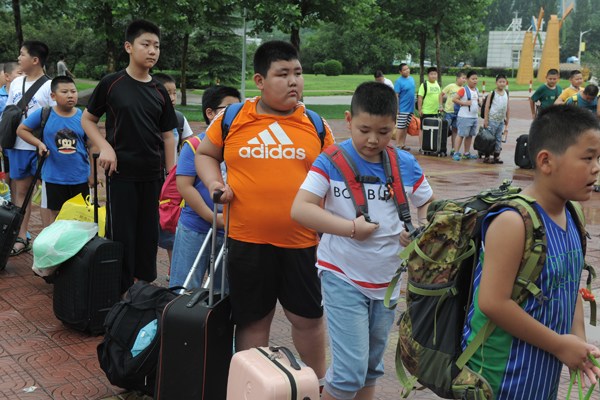 Elementary and middle school students get ready for a 10-day training camp to lose weight in Jinan, Shandong province. About 500 participated. Provided To China Daily