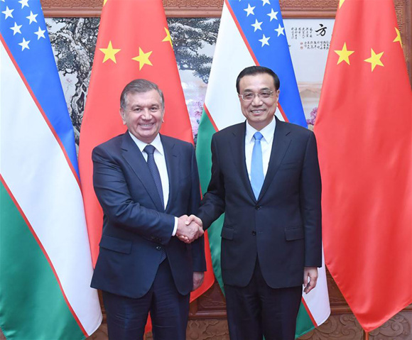 Chinese Premier Li Keqiang (R) meets with Uzbek President Shavkat Mirziyoyev, who is here for a state visit and the upcoming Belt and Road Forum (BRF) for International Cooperation, at the Great Hall of the People in Beijing, capital of China, May 13, 2017. (Xinhua/Zhang Duo)