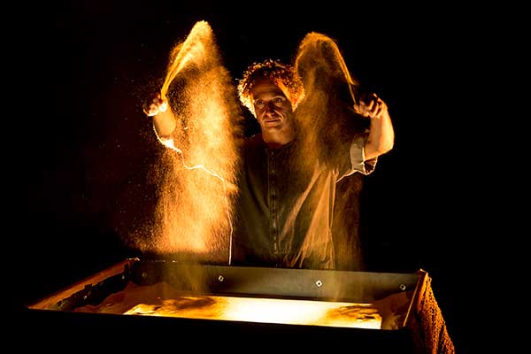 Spanish painter Borja Gonzalez will work with his band to perform Dreams of Sand, a show that combines sand art, live music, big-sized puppets and speed painting in Beijing.(Photo provided to China Daily)