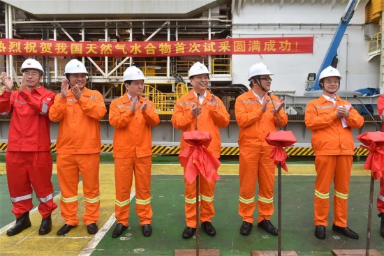 Chinese Minister of Land and Resources Jiang Daming (3rd R) announces the success in trial mining of combustible ice at sea, on a trial mining site in the Shenhu area of the South China Sea, May 18, 2017. (Xinhua/Liang Xu)