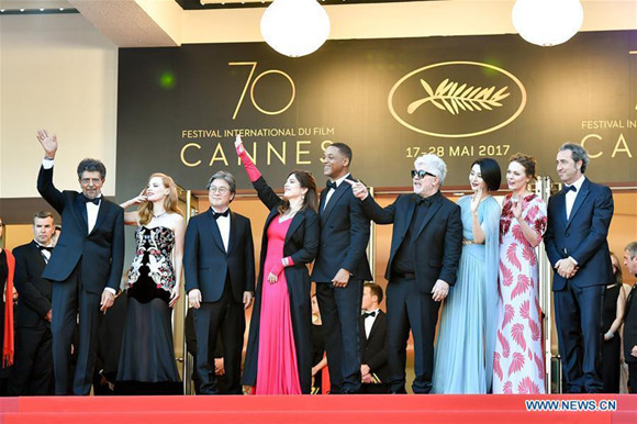 Jury member for the 70th Cannes International Film Festival, Chinese actress Fan Bingbing (3rd R) poses for photos on the red carpet at the opening of the 70th Cannes International Film Festival in Cannes, France, on May 17, 2017. The 70th Cannes International Film Festival is held here from May 17 to May 28. (Xinhua/Chen Yichen)