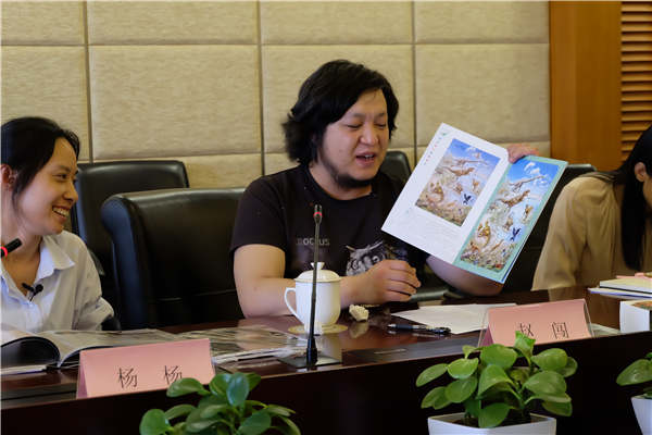 Zhao Chuang, an artist in Beijing, has collaborated with China Post on two sheets of stamps, Chinese Dinosaurs, which were issued on Friday. (Photo provided to China Daily)