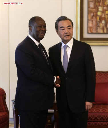 Cote d'Ivoire President Alassane Ouattara (L) shakes hands with Chinese Foreign Minister Wang Yi in Abidjan, Cote d'Ivoire, May 22, 2017. (Xinhua/Ivan)