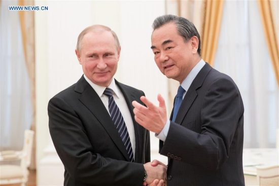 Russian President Vladimir Putin (L) meets with visiting Chinese Foreign Minister Wang Yi in the Kremlin, Moscow, Russia on May 25, 2017. (Xinhua/Wu Zhuang)