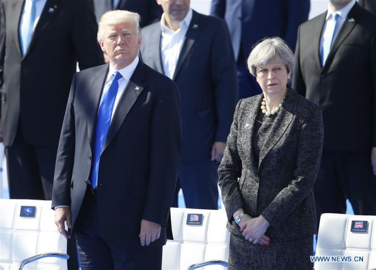 U.S. President Donald Trump (L) and British Prime Minister Theresa May (R) attend the handover ceremony of the new NATO headquarters during a one-day NATO Summit, in Brussels, Belgium, May 25, 2017. (Xinhua/Ye Pingfan)