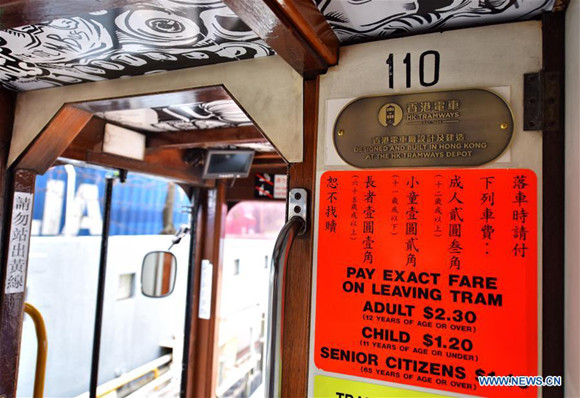 A new sign showing the ticket prices is seen in a newly-decorated tram in Hong Kong, south China, May 26, 2017. The HK Tramways revealed its new logo on Friday. Trams, known as ding-dings for the sound of their bells, have serviced the city's main island for more than a century. (Xinhua/Wang Xi)