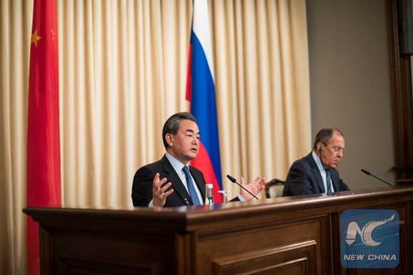 Chinese Foreign Minister Wang Yi (L) speaks at a press conference following a meeting with his Russian counterpart Sergei Lavrov in Moscow, Russia, on May 26. (Xinhua/Wu Zhuang)
