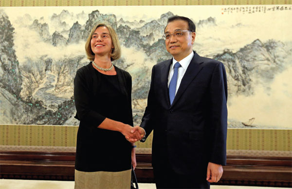 Premier Li Keqiang greets Federica Mogherini, the European Union's high representative for foreign affairs and security policy, before their meeting at the Zhongnanhai leadership compound in Beijing on April 18. Feng Yongbin / China Daily