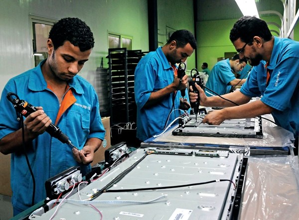 Egyptian Hisense Group workers assemble TV sets in the Suez Bay Northwest Economic Zone on September 21, 2011.