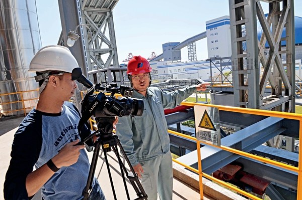 Technicians use monitoring equipment to measure functions at China Huadian Engineering Co., Ltd. Bali Coal-fired Power Plant in Indonesia on June 1, 2015.