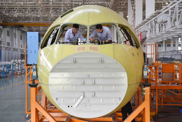 Engineers test the windshield of the C919 at a facility in Chengdu, Sichuan province. LIU KUN / XINHUA