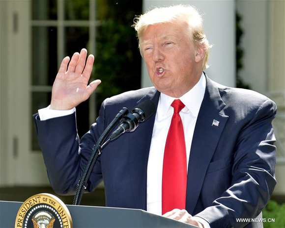 U.S. President Donald Trump gestures as he delivers a speech at the White House in Washington D.C., capital of the United States, on June 1, 2017. U.S. President Donald Trump said on Thursday that he has decided to pull the United States out of the Paris Agreement, a landmark global pact to fight climate change. (Xinhua/Mike Theiler)