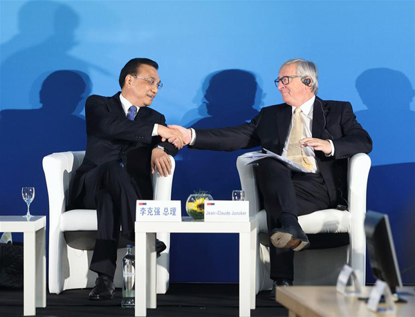 Chinese Premier Li Keqiang (L) and European Commission President Jean-Claude Juncker attend the 12th EU-China Business Summit in Brussels, Belgium, June 2, 2017. (Xinhua/Wang Ye)