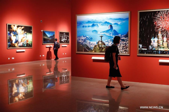 People visit the Golden BRICS Shining into Future -- BRICS Media Joint Photography Exhibition in Beijing, capital of China, June 7, 2017. The exhibition kicked off here on Wednesday. (Xinhua/Shen Bohan)