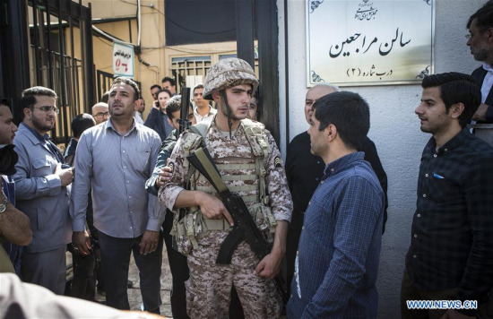 An Iranian policeman stands guard outside Iran's parliament in Tehran, Iran, on June 7, 2017.  (Xinhua/Ahmad Halabisaz)