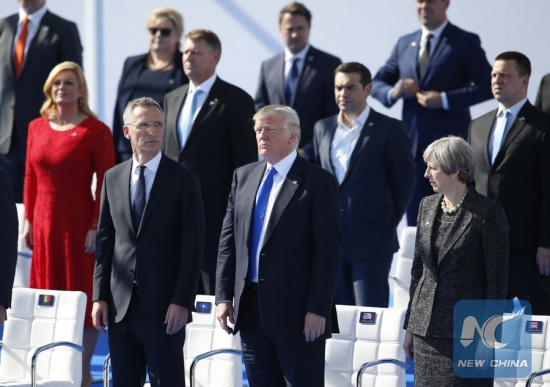 The file photo taken on May 25, 2017 shows that NATO Secretary General Jens Stoltenberg, U.S. President Donald Trump, British Prime Minister Theresa May (from L to R, front) and other NATO member states leaders attend the handover ceremony of the new NATO headquarters during a one-day NATO Summit, in Brussels, Belgium. (Xinhua/Ye Pingfan)
