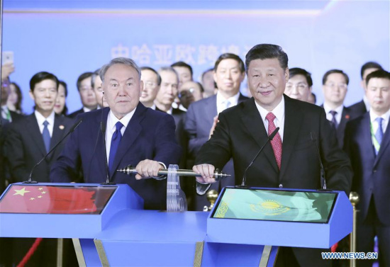 Chinese President Xi Jinping (R front) and his Kazakh counterpart Nursultan Nazarbayev (L front) inspect via videolink two key hubs of the cross-border transportation at the Chinese national pavilion of the Expo 2017 in Astana, Kazakhstan, June 8, 2017.(Xinhua/Ding Lin)