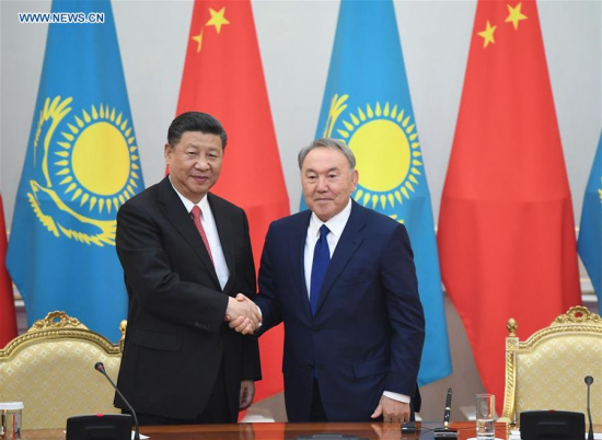 Chinese President Xi Jinping (L) shakes hands with his Kazakh counterpart Nursultan Nazarbayev as they signed a China-Kazakhstan joint statement and witnessed the inking of a series of bilateral cooperation documents after their talks in Astana, Kazakhstan, June 8, 2017. (Xinhua/Wu Xiaoling)