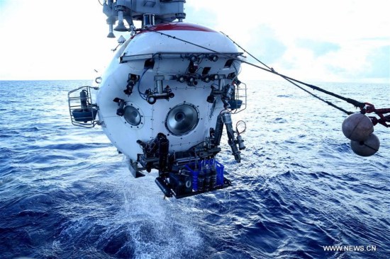 Manned submersible Jiaolong leaves the water after its dive in Yap Trench, June 11, 2017. Jiaolong completed its 151th dive on Sunday since 2009. (Xinhua/Liu Shiping)