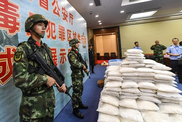 Stacks of drugs are displayed at the Guangdong Public Security Department on Wednesday. Guangdong police seized more than 640 kilograms of narcotics since April.CHEN JIMIN/CHINA NEWS SERVICE