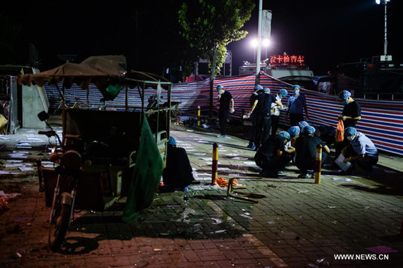Forensic experts work at the site of the explosion near a kindergarten in Fengxian County in east China's Jiangsu Province, June 16, 2017.   (Xinhua/Li Xiang)