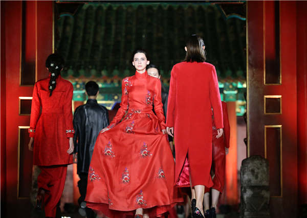 Models show creations of fashion brands that demonstrate how they enliven Chinese garments at a recent runway show at Prince Gong's Mansion in Beijing. (Photo by Jiang Dong/China Daily)