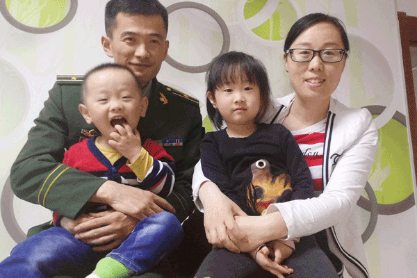 Zhao Lujie and Gu Suli with their two children at home in Beiji village, Heilongjiang province. Photo Provided To China Daily