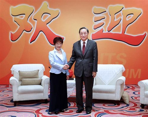 Yu Zhengsheng (R), chairman of the National Committee of the Chinese People's Political Consultative Conference, shakes hands with Hung Hsiu-chu, chairperson of the Taiwan-based Kuomintang (KMT) party at the ongoing 9th Straits Forum in Xiamen of southeast China's Fujian Province, June 17, 2017. (Xinhua/Ma Zhancheng)