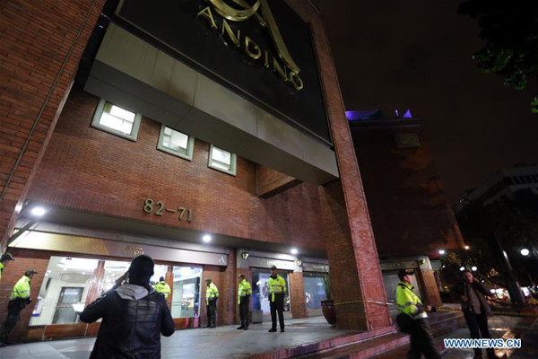 Policemen guard outside the Andino shopping mall after a blast, in Bogota, capital of Colombia, on June 17, 2017. A strong blast rocked a shopping mall in Colombia's capital Saturday, killing one and injuring 11 others, local media reported. (Xinhua/COLPRENSA)