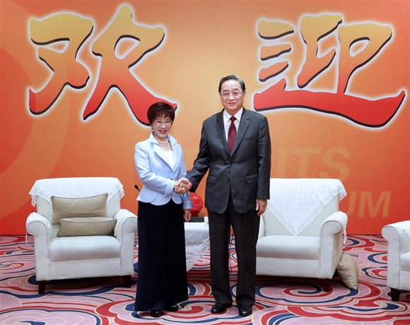 Yu Zhengsheng (R), chairman of the National Committee of the Chinese People's Political Consultative Conference, shakes hands with Hung Hsiu-chu, chairperson of the Taiwan-based Kuomintang (KMT) party at the ongoing 9th Straits Forum in Xiamen of southeast China's Fujian Province, June 17, 2017. (Xinhua/Ma Zhancheng)